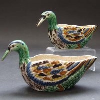 Lot 546 - Two Pratt ware duck sauce boats.