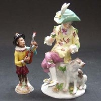Lot 555 - Continental porcelain figure and a monkey guitar