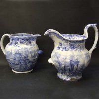 Lot 562 - Two large blue and white pottery water jugs