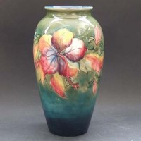 Lot 631 - Moorcroft hibiscus pattern vase.