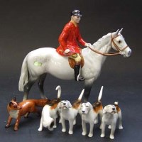 Lot 639 - Beswick grey huntsman, fox, four hounds.