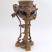 Lot 669 - Late 19th century metal and porcelain oil lamp.