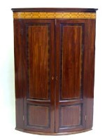 Lot 712 - Mahogany bow-fronted corner cabinet.