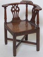 Lot 729 - Carved oak corner chair.