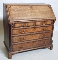 Lot 768 - George III oak bureau.
