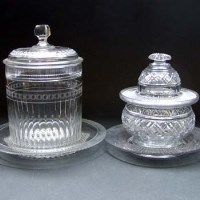 Lot 335 - Two cut glass lidded bowls and stands.