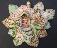 Lot 428 - Pendelfin ware Pixie House wall plaque.