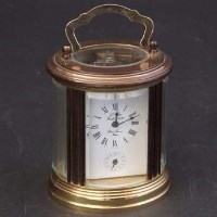 Lot 447 - Oval alarm timepiece
