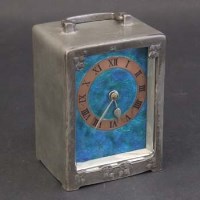 Lot 452 - Liberty & Co pewter clock.