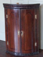 Lot 480 - George III oak corner cabinet