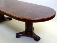 Lot 489 - Silverlining Regency style dining table figured mahogany veneered two piece top with ebony cross banding, all standing on two reeded columns