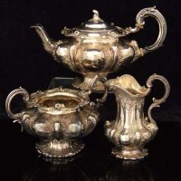 Lot 225 - Silver melon shaped three piece tea set