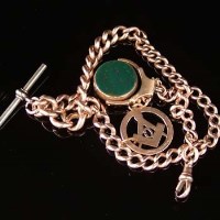 Lot 238 - 9ct gold graduated flat curb watch chain with an