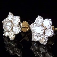 Lot 265 - Pair of seven stone diamond earrings