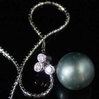 Lot 294 - South Seas 14mm pearl and diamond on 18ct chain