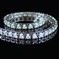 Lot 302 - Diamond and 18 carat white gold line bracelet