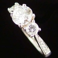 Lot 318 - 18ct white gold and diamond ring, the central