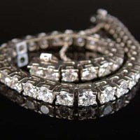 Lot 325 - White gold and diamond line bracelet