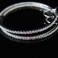 Lot 354 - Pair of diamond and white gold ear hoops