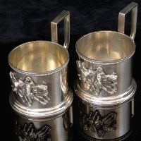 Lot 305 - Pair of Russian silver cup holders, both applied