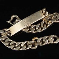 Lot 329 - 9 carat gold I D bracelet