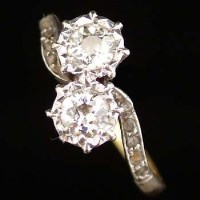 Lot 345 - 18ct gold and diamond cross-over ring, on