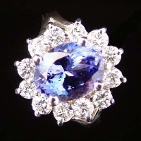 Lot 351 - Tanzanite and diamond oval cluster ring, the