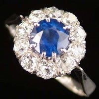 Lot 352 - Sapphire and diamond floret cluster ring, the