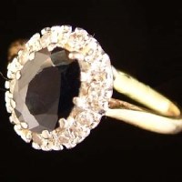 Lot 386 - 18ct gold oval sapphire and eight-cut diamond