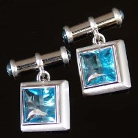 Lot 392 - Pair of blue topaz and 18ct white gold square