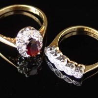 Lot 396 - 18ct gold garnet and diamond oval cluster ring