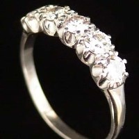 Lot 401 - 18ct white gold five stone diamond ring.