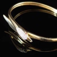 Lot 407 - Yellow gold diamond bangle