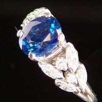 Lot 416 - Ceylon sapphire and diamond ring, the oval stone