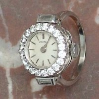 Lot 422 - Vertex platinum and diamond ring watch, matt