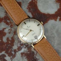 Lot 425 - Cobra Automatic 18ct gold wrist watch, matt