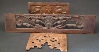 Lot 436 - Carved oak Green Man panel, a tracery panel, and