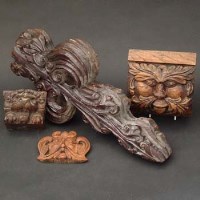 Lot 437 - Carved Green Man corbel, a similar item, a lion