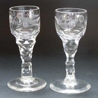 Lot 520 - Pair of facetted stem wine glasses