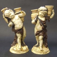 Lot 591 - Pair of continental cherub water carriers