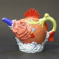 Lot 634 - Royal Doulton fish teapot