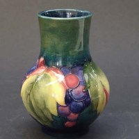 Lot 662 - Moorcroft leaf and berry pattern vase