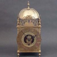Lot 694 - Brass lantern clock Eureka Clock Company