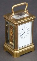 Lot 711 - Miniature brass carriage clock