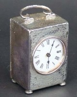 Lot 712 - Hammered silver cased carriage clock