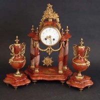 Lot 715 - Pink marble clock garniture
