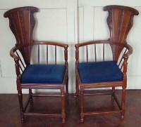 Lot 751 - Pair of continental walnut corner chairs circa