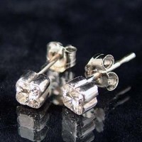 Lot 334 - Pair platinum lily-cut ear studs