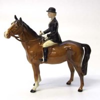 Lot 609 - Beswick huntswoman on brown horse.