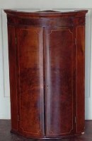 Lot 650 - George III boxwood string corner cupboard.